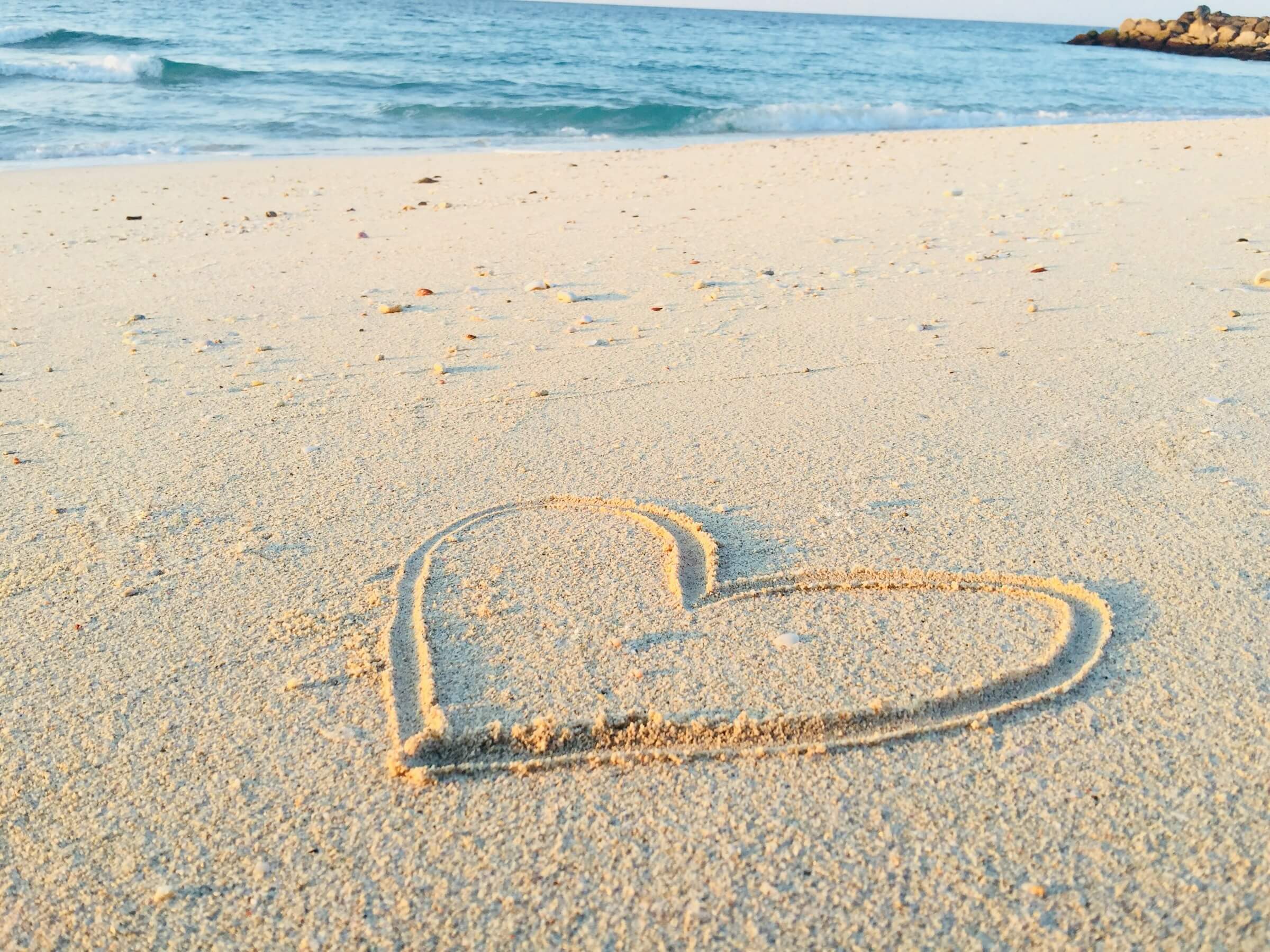 This image shows a heart drawn in the sand, representing "favorite" in the context of Comparison among Three or More Items.
